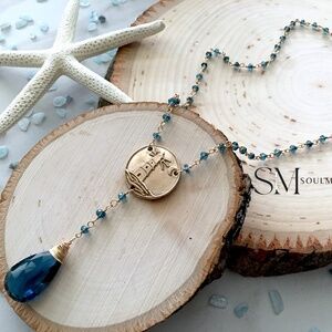 Lighthouse blue topaz necklace. London blue topaz necklace that is a birth stone